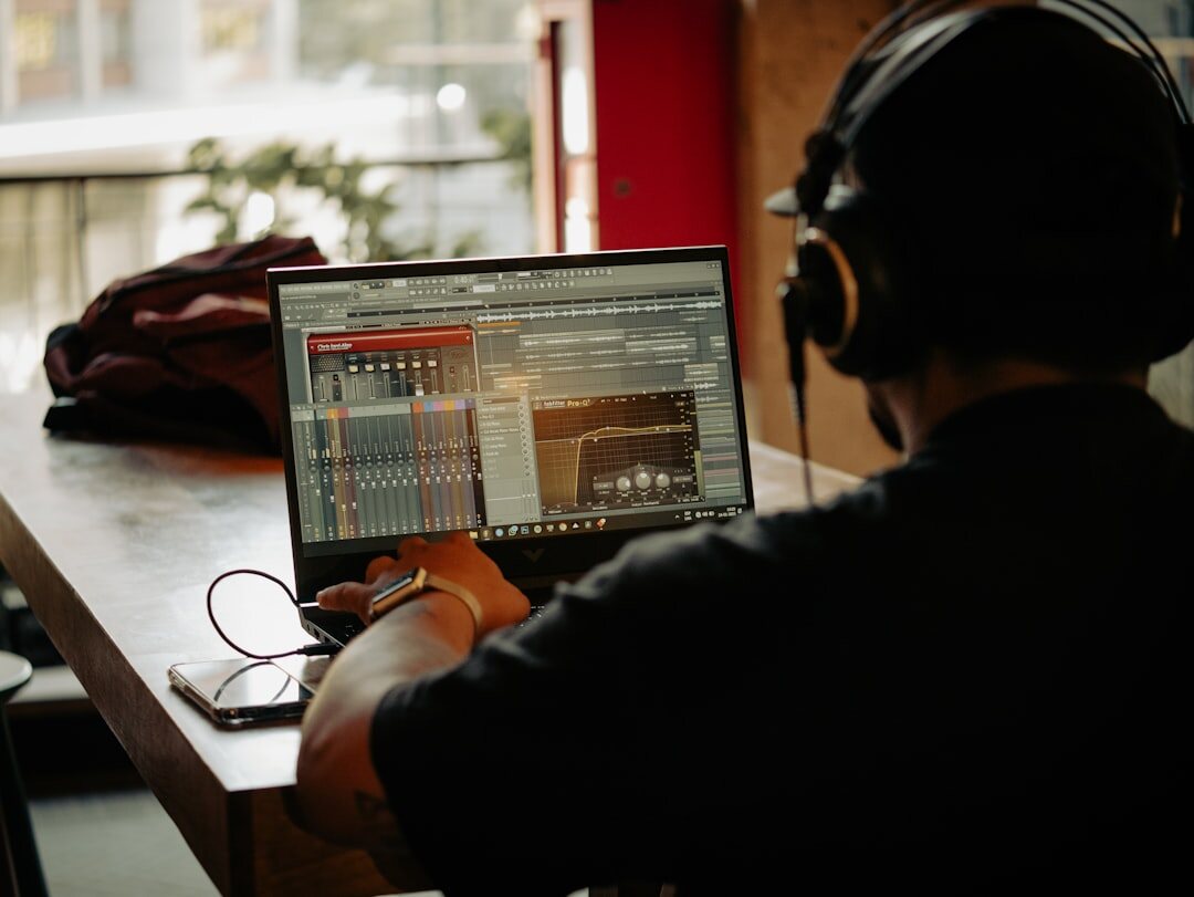 Production team collaborating around a studio console